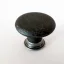 Möbelknopf aus Metall in Ockerschwarz