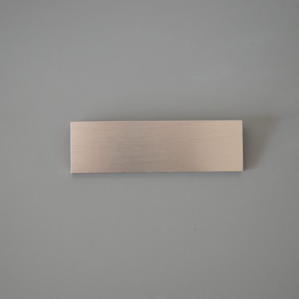 LUCATA fém bútorfogantyú, fényes felületű, nemesacél imitáció, 64 mm furattávval