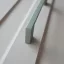 2576_PS8_160  fém bútorfogantyú, oliva zöld színű, 160 mm furattávval
