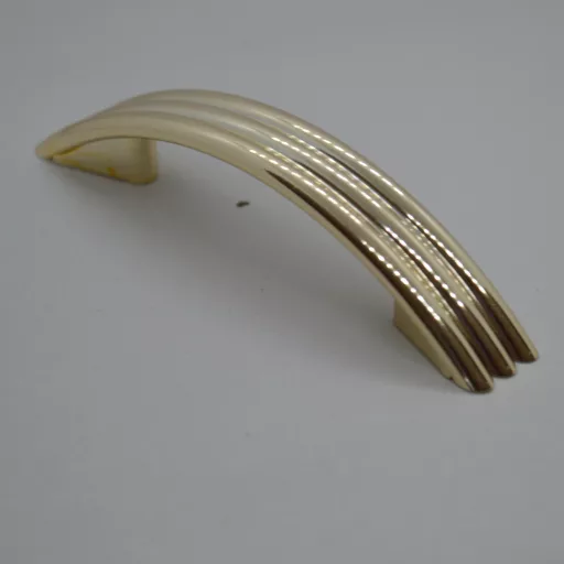 Kunststoff-Möbelgriff, gold, mit 64 mm BA