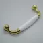 Metall-Kunststoff-Möbelgriff, Farbe gold-weiss, Bohrung 96 mm