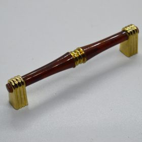   1096 RETRO Fém-műanyag bútorfogantyú, arany-mahagóni színű, 96 mm furattávval