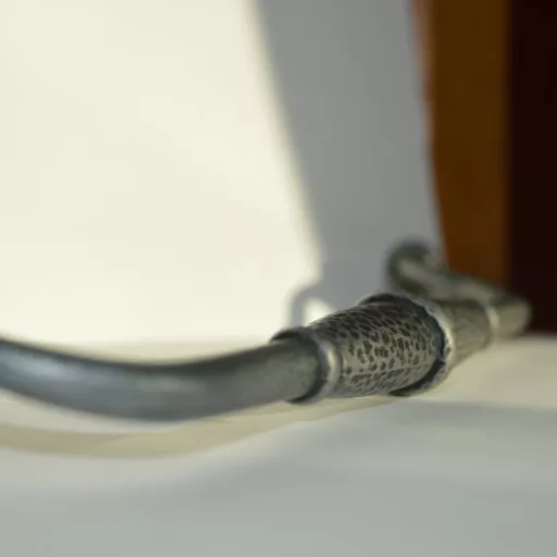 Fém bútorfogantyú, antik fekete színű, 224 mm furattávval