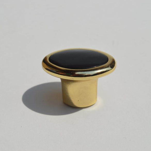 Retro-Möbelgriff mit goldfarbenem Metallende - kombiniert mit schwarzem Kunststoffelement