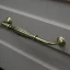 Fém bútorfogantyú, antik bronz színű, 128 mm furattávval