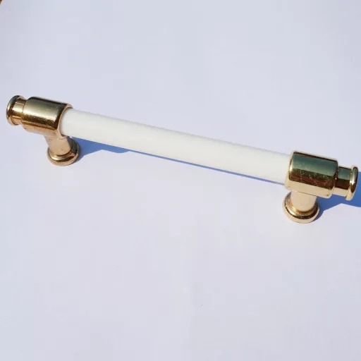 Kunststoff-Metall-Möbelgriff, Farbe weiß-gold , Bohrung 128 mm, Class 2