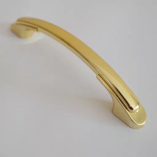 Kunststoff-Möbelgriff, schwarzes Ende - goldfarben, Bohrung 96 mm