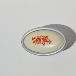   Metall-Kunststoff-Möbelgriff in Chrom matt mit braunem Blumenmotiv, 16 mm Lochabstand