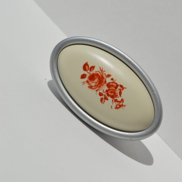 Metall-Kunststoff-Möbelgriff in Chrom matt mit braunem Blumenmotiv, 16 mm Lochabstand