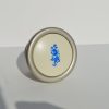 Metall-Kunststoff-Möbelknopf in Champagnerfarbe mit blauem Blumenmuster