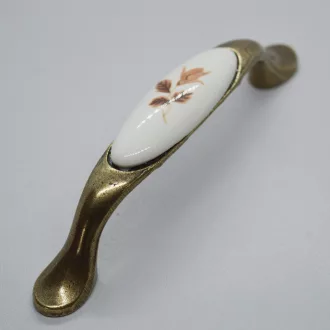   Porcelán-fém bútorfogantyú, bronz - barna virág motívummal, 96 mm furattávval