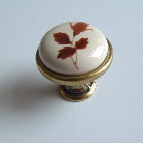   Porcelán-fém bútorgomb, fehér - bronz színű véggel, barna virág motívummal 