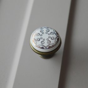   Fém-porcelán bútorgomb, bronz talp - arany színű motívummal 