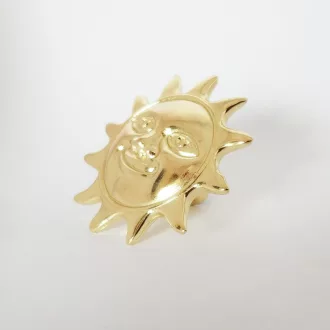 Möbelknauf aus Metall mit goldenem Sonnenmotiv