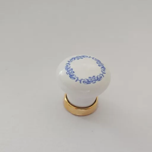 Weißer Porzellan-Möbelknopf mit blauem Motiv