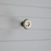 Fém-porcelán bútorgomb, bronz színű, barna virág motívummal