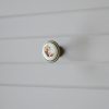 Fém-porcelán bútorgomb, bronz színű, barna virág motívummal