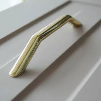 UN78 – Möbelgriff mit 128 mm Bohrung, goldfarben