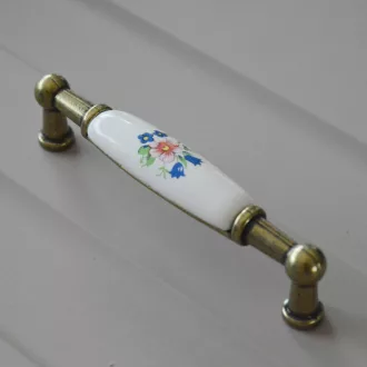   Porcelán-fém bútorfogantyú, antik bronz-színes virággal, 96 mm furattávval