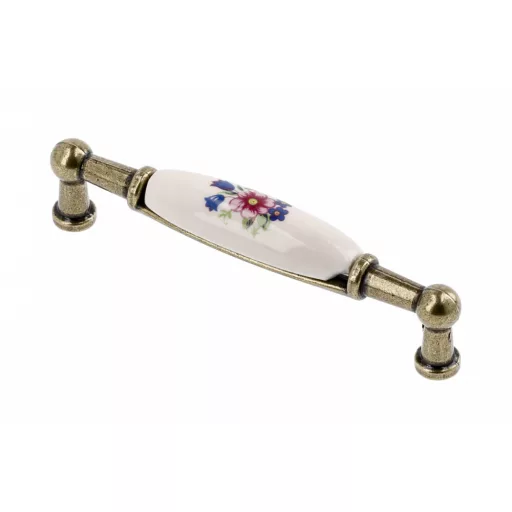 Porcelán-fém bútorfogantyú, antik bronz-színes virággal, 96 mm furattávval