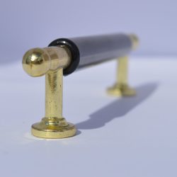 Gold-black metal-plastic furniture handle 