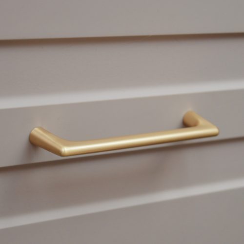 OCTAVIO Fém fogantyú, 128 mm furattáv, csiszolt arany